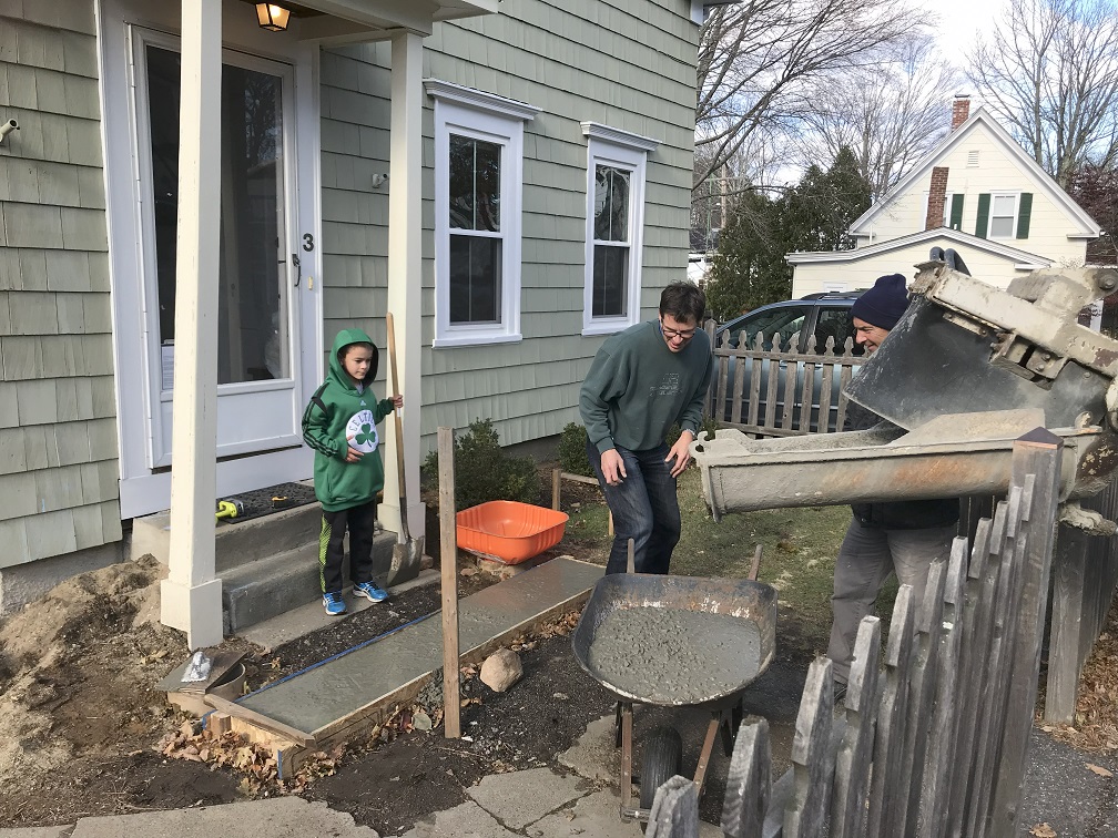Henry and family working on the front porch